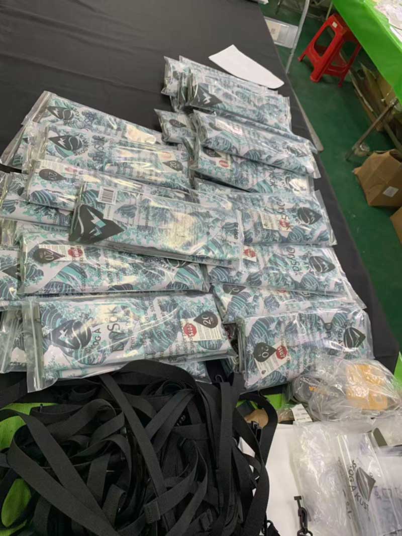Printed dry bags individually bagged with retail cards showing capacity